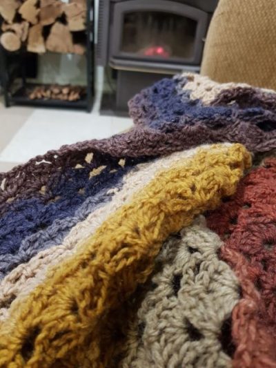 relaxing in front of the fireplace with my crochet